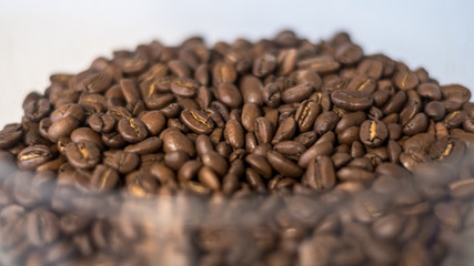 Isolated close up of fresh roasted coffee beans