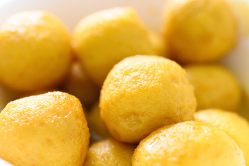 side view curry flavor fish balls in bowl