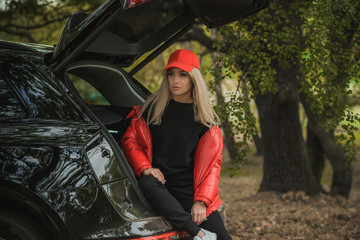 Gorgeous woman with a car, luxury style, concept lady and automobile