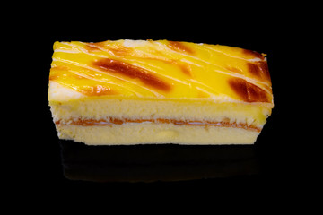 high angle view square shape cheese cake on black background