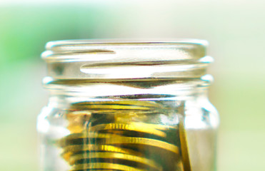 close up of gold coins of bottles