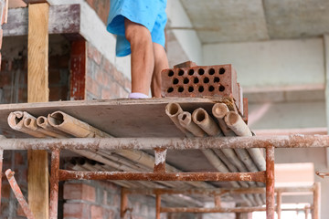 plasterer making up a brick wall