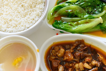 top view braised veal cheeks with cabbage and maize soup and rice