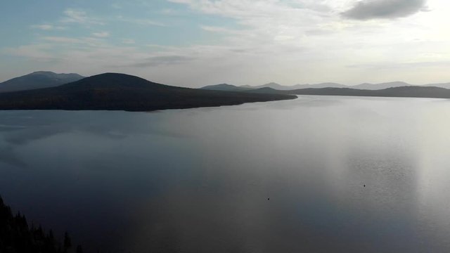 Aerial photography. Top view of the mountain lake Zyuratkul in the Urals. Sunny day in the mountains