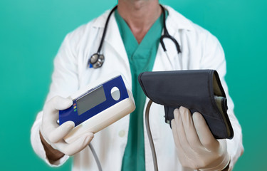 Close-up of a doctor with uniform and stethoscope, which is showing a sphygomanometer for the...