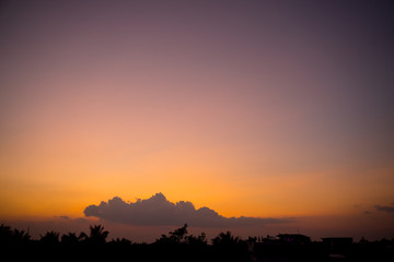 Fiery sunset landscape with darkness foreground in siem reap city in Cambodia during rainy season 