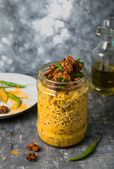 salads and main course in glass jars