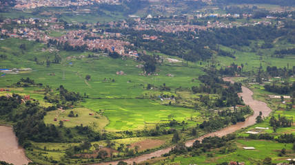 Fototapeta na wymiar Aerial view of a river flowing through fields