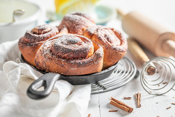 Delicious cinnamon buns with spices, cocoa and sugar