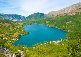 Fototapeta na wymiar Lake Scanno (L'Aquila, Italy) - When nature is romantic: the heart - shaped lake on the Apennines mountains, in Abruzzo region, central Italy, during the autumn with foliage