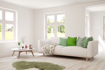 Stylish room in white color with sofa and summer landscape in window. Scandinavian interior design. 3D illustration