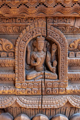 Detailed wood carvings of Hindu Gods and sculptures on ancient temples of Nepal.