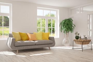 Stylish room in white color with sofa and summer landscape in window. Scandinavian interior design. 3D illustration