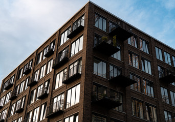 Golden light hitting a building full of balconies