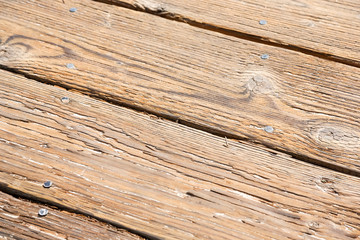 A closeup of wooden boards on a boardwalk.