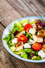 Caesar salad on wooden table