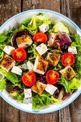 Caesar salad on wooden table