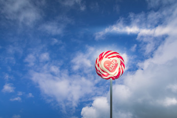 Striped red and white lollipop with Love