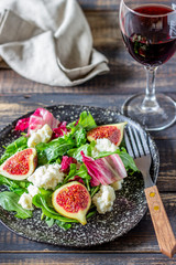 Salad with figs, cheese and honey. Healthy eating.