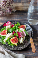 Salad with figs, cheese and honey. Healthy eating.