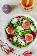 Salad with figs, cheese and honey. Healthy eating.