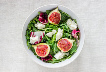 Salad with figs, cheese and honey. Healthy eating.