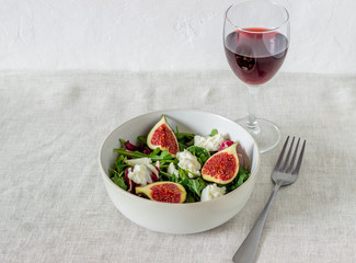 Salad with figs, cheese and honey. Healthy eating.