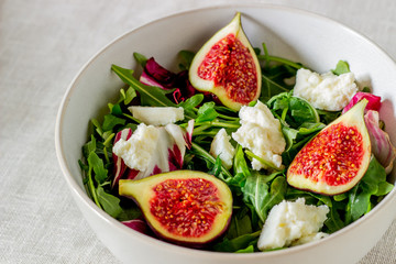 Salad with figs, cheese and honey. Healthy eating.