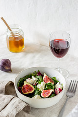 Salad with figs, cheese and honey. Healthy eating.