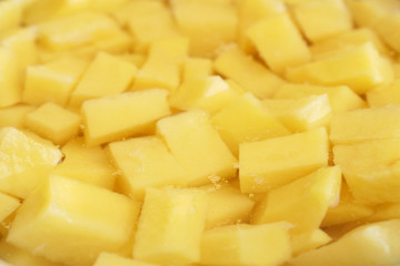 Sliced peeled raw potato in the water. Side view. Selective focus. Food background	