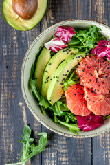 Salad with avocado and grapefruit. Healthy eating. Vegetarian food.