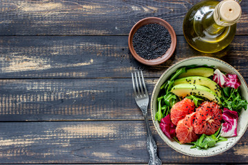 Salad with avocado and grapefruit. Healthy eating. Vegetarian food.