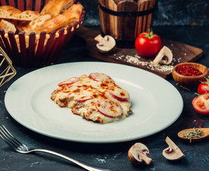 Cheese casserole with tomatoes and mushrooms
