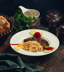 Spaghetti with finely chopped pieces of meat