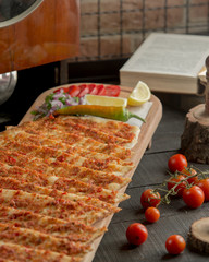 Meat lahmajun meat lahmajun served with pepper and lemon