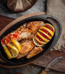 Fried chicken with lemon and pomegranate