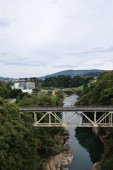 Fototapeta na wymiar The overpass which hangs over the ravine - Nariaibashi brigde,Nariaikyo valley,Hirosegawa river,