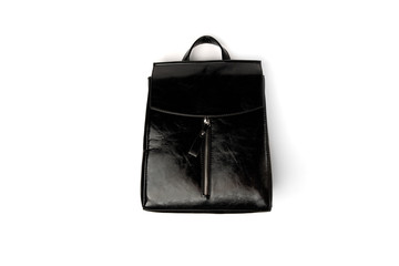 Naklejka premium Black leather backpack isolated on white background.