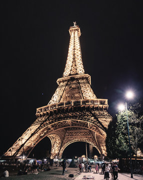 25 July 2019, Paris, France: wonderful Eiffel Tower glows against the night sky. Tourist attractions in Europe and the World