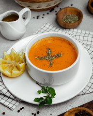 Lentil soup served with lemon