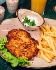 Grilled chicken breast with fries