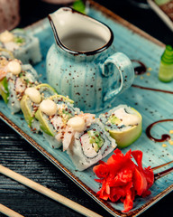 Sushi roll set topped with sesame