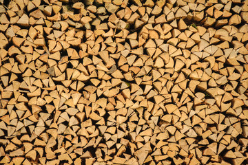An array of firewood for burning in a stove is piled.