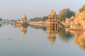 Gadisar lake in the morning. Man-made water reservoir with temples in Jaisalmer. India