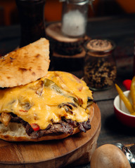 Meat slices in bread with melted cheese