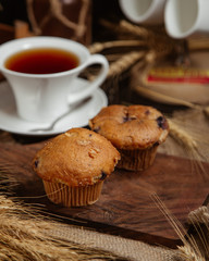 Chocolate brownies served with a cup of tea