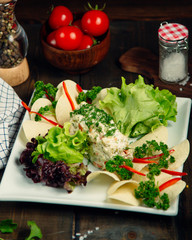 Russian salad topped with herbs