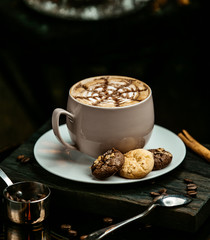 Hot chocolate served with cookies