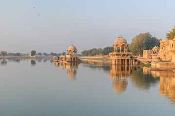 Gadisar lake in the morning. Man-made water reservoir with temples in Jaisalmer. India