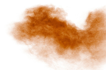 Brown dust explosion cloud.Brown particles splattered on white background.